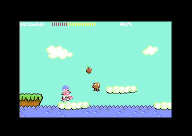 C64 Wonder Boy round 1-2: the boy over the sea next to the island, with an octopus leaping beside him