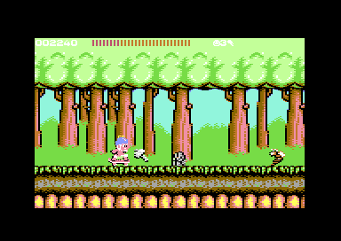 Wonder Boy on his skateboard in the round 1-1 forest, throwing his hatchet at a bee